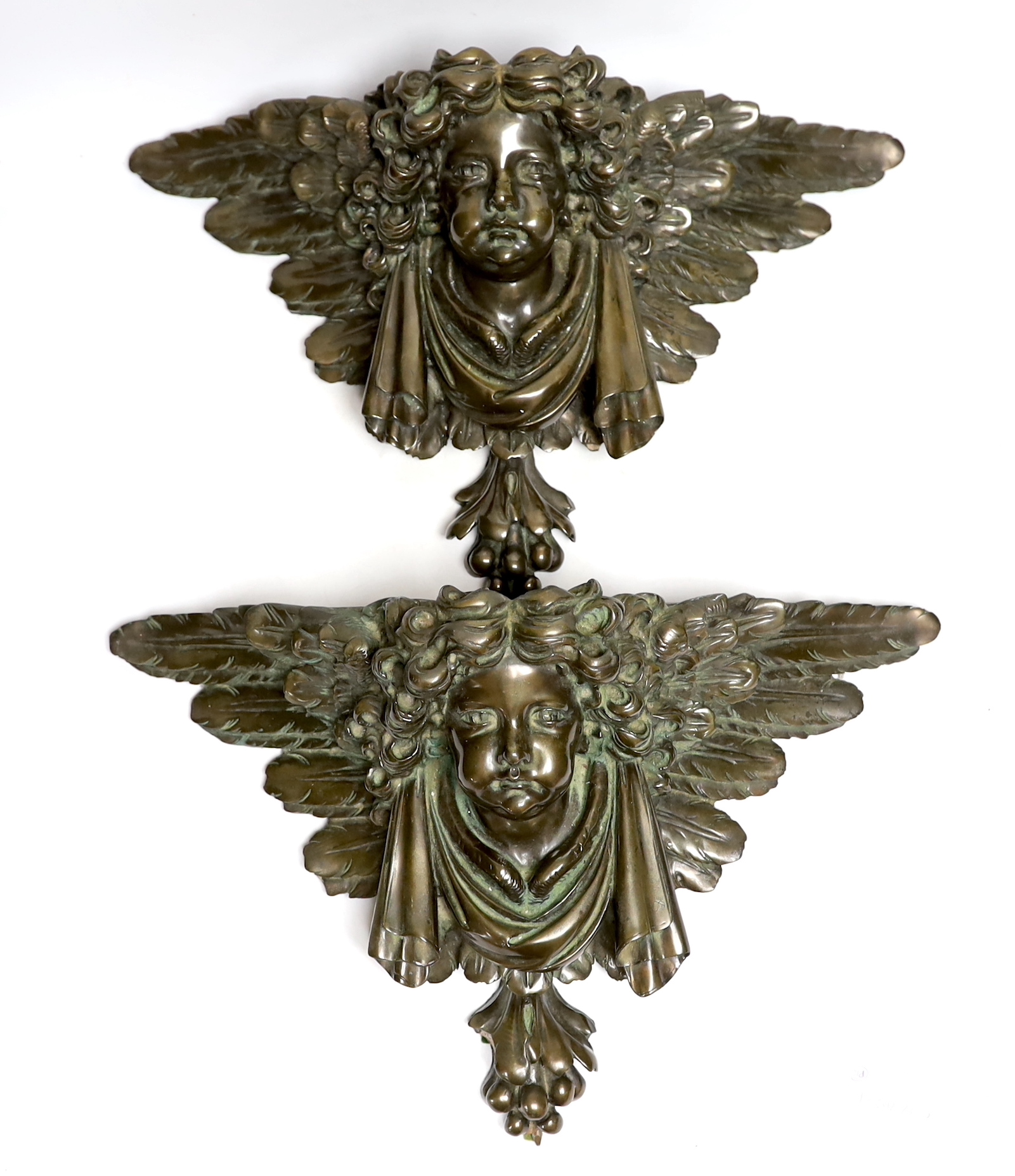 A pair of resin cherub brackets 'bronzed', 29 x 47cm